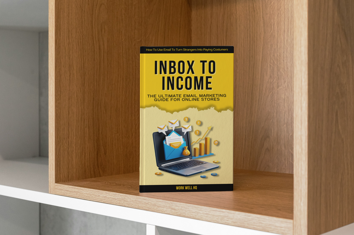 Book titled 'Inbox to Income' on a wooden shelf